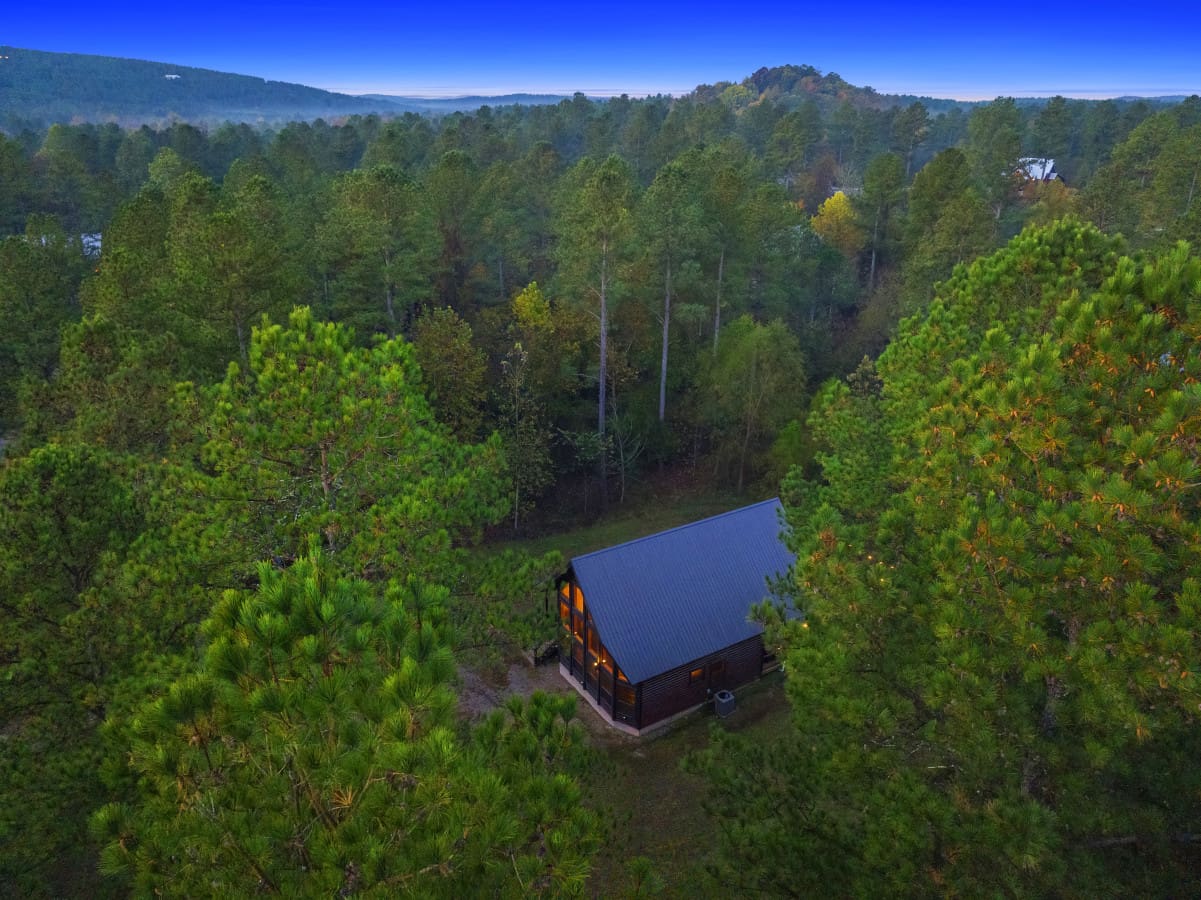 Above the canopy, a tranquil cabin retreat.