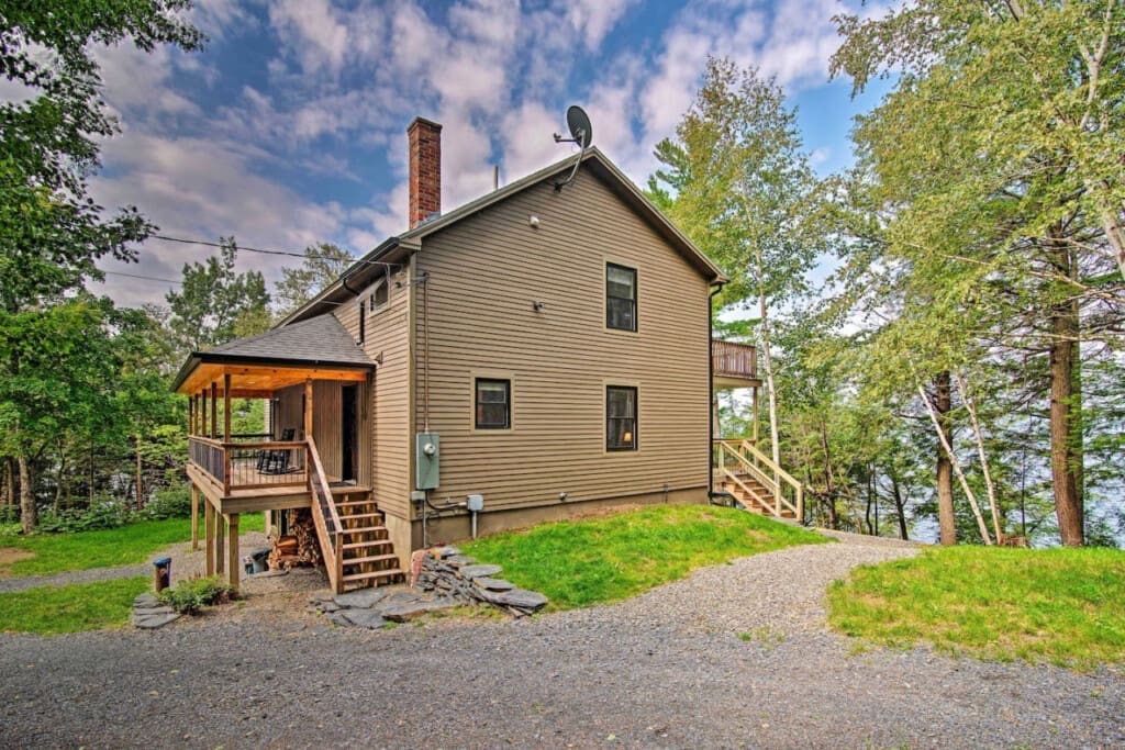 Peekaboo Charm: A Side View Offering a Glimpse of Cabin Coziness Amidst Nature's Bounty.
