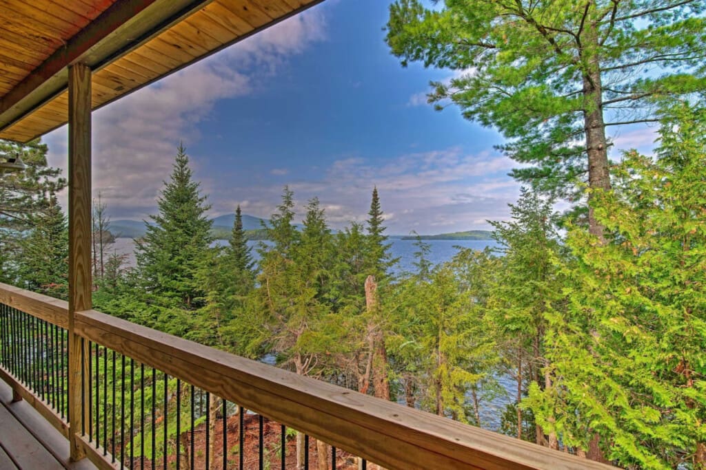 Where Towering Trees Frame a Glimpse of the Majestic Ocean Beyond.