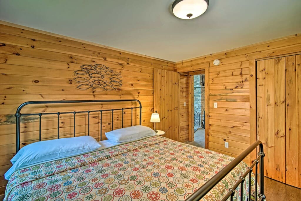 Forest Fantasy: Where Wooden Walls Bring the Outdoors Inside Your Bedroom.