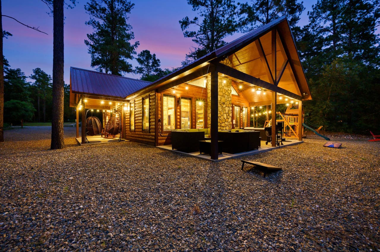 Glowing warmly in the night, our cabin awaits