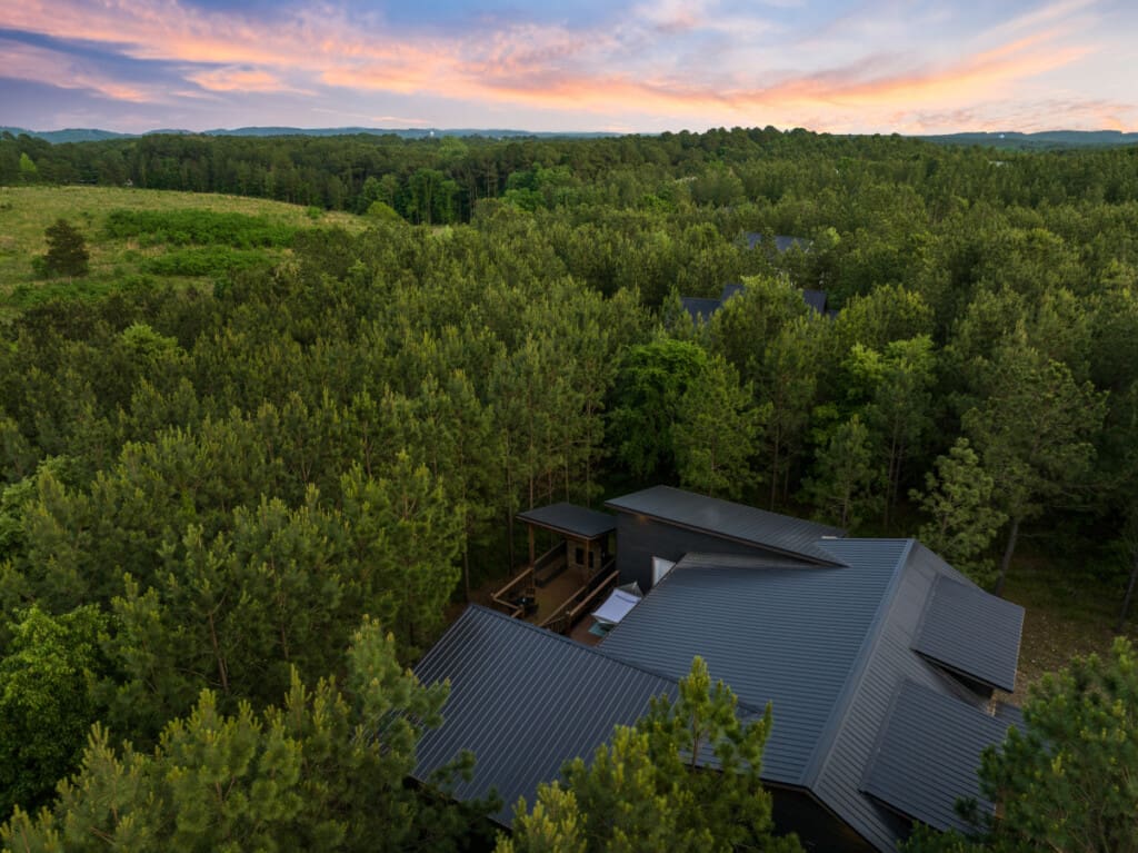 High above, where our cabin nestles in nature's embrace. 🌳