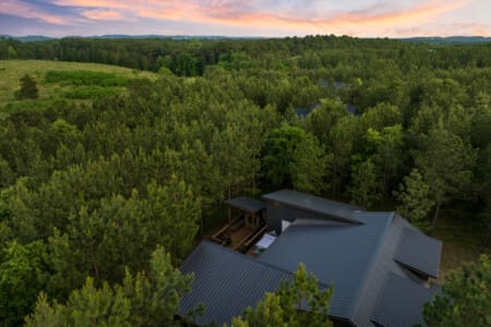 High above, where our cabin nestles in nature's embrace. 🌳