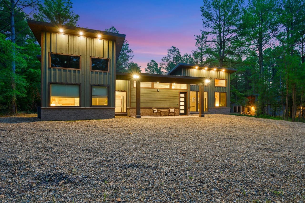 A warm welcome and stunning vistas from the front view of your serene cabin escape.