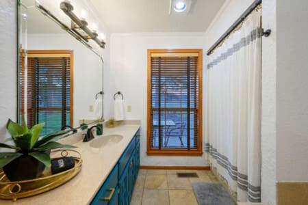 Refresh and rejuvenate in the rustic charm of our cabin’s cozy bathroom retreat.