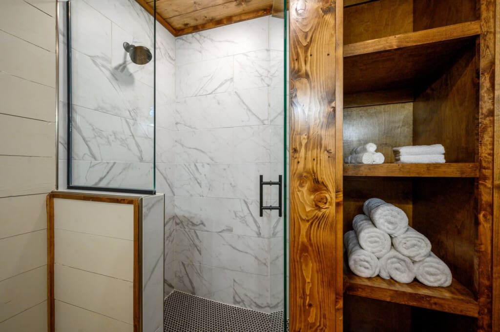 Embrace the luxury of a spa-like experience at home with our contemporary glass door shower.