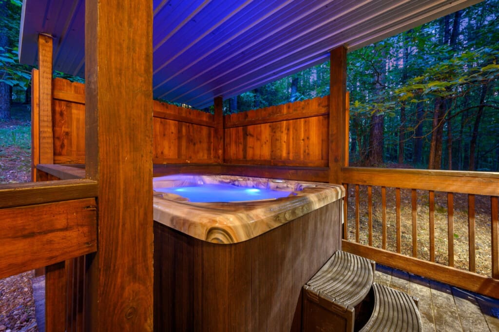 Escape to bliss with our bubbling hot tub, perfect for soothing tired muscles.