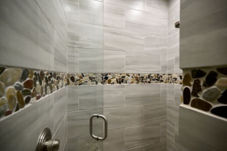 Step into elegance with a glass door shower that blends luxury and simplicity.