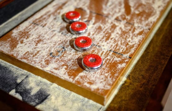 Turn game night into a winning experience with our sleek shuffleboard table—perfect for endless entertainment.