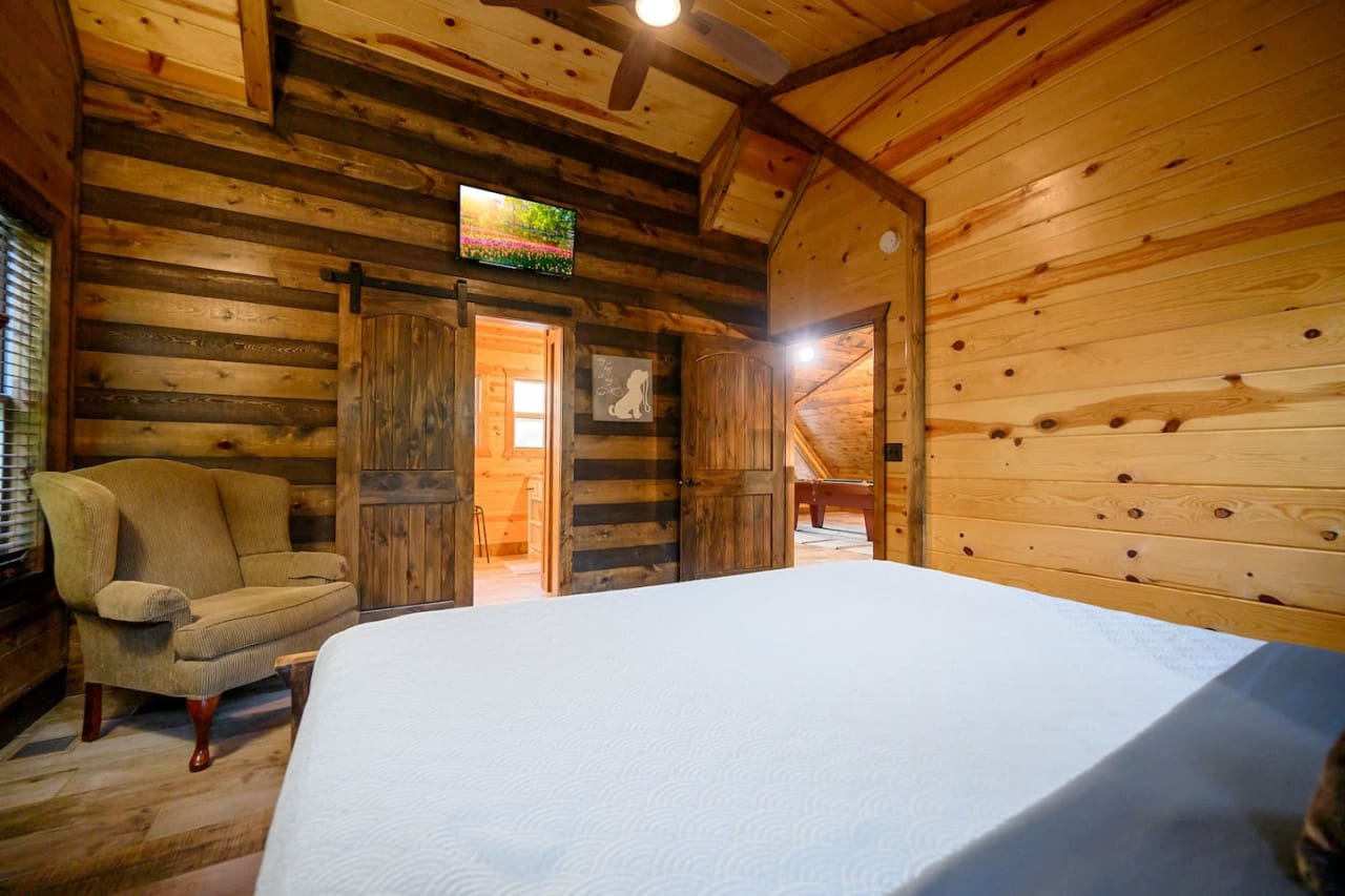 Curl up with a book or simply enjoy the view from our charming bedroom, complete with a soft rug and cozy chair.