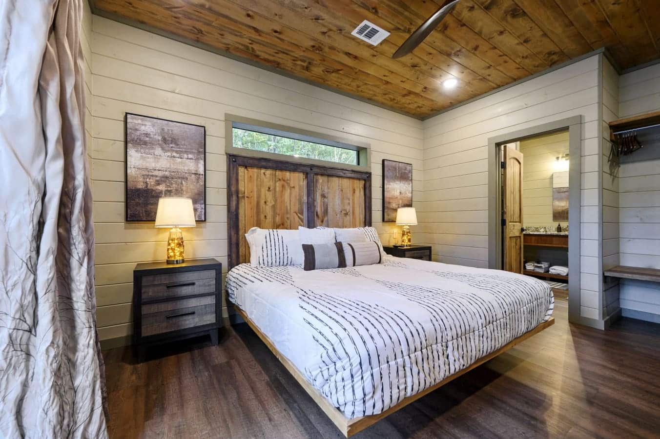 Cozy bedroom with plush bedding.