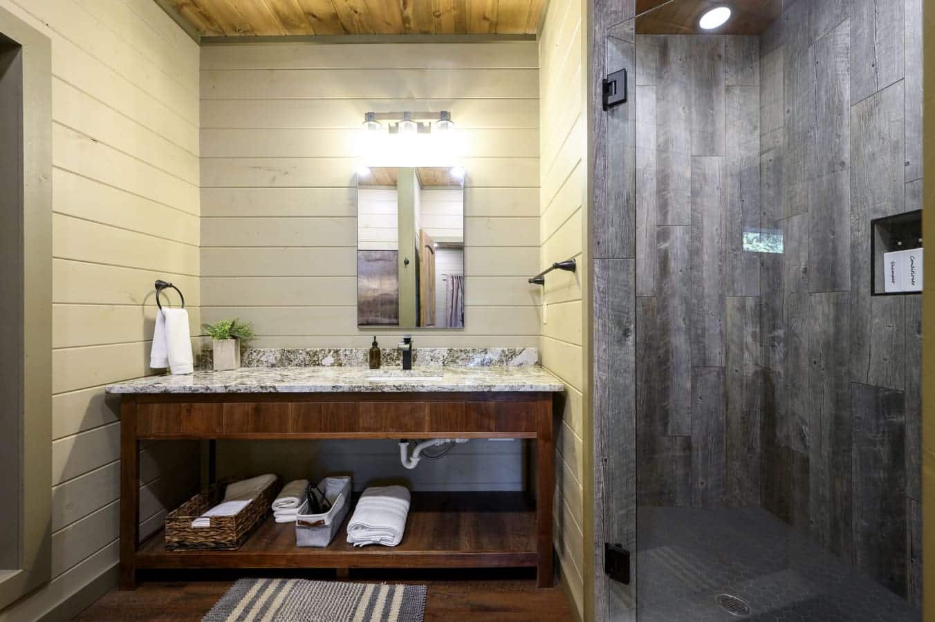 Sleek and modern bathroom featuring a spacious walk-in shower.