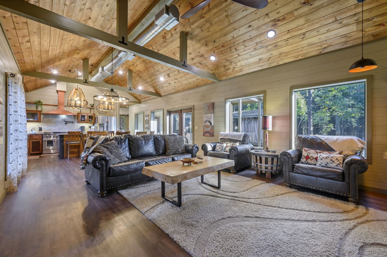 Cozy up by the fire in this beautiful and rustic-modern living space.