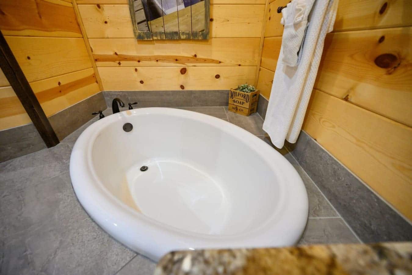 This soaking tub is seriously sunken right into the concrete floor, giving you that luxe spa vibe in the middle of the cabin.