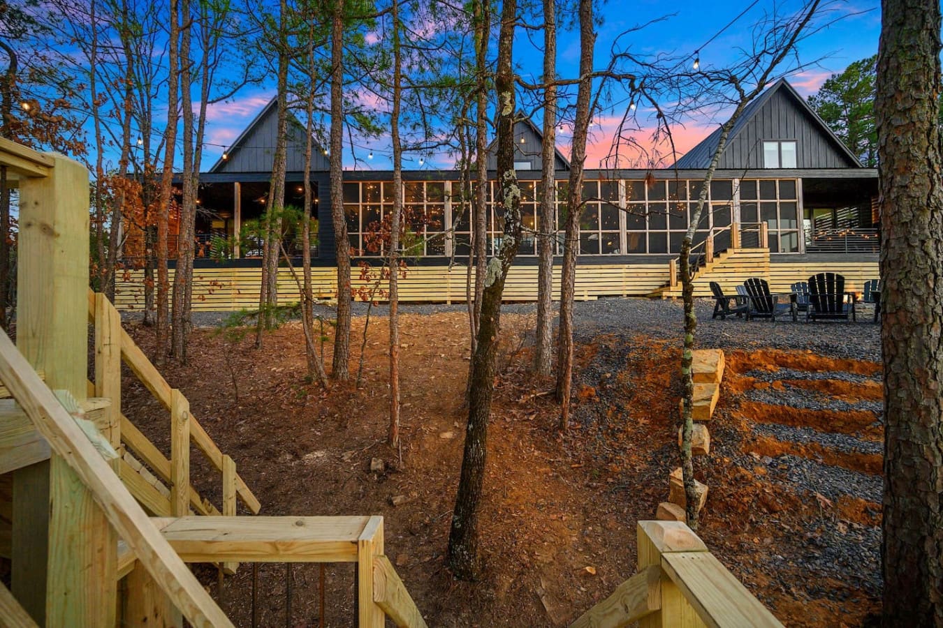 This modern forest retreat with its dramatic peaked roofs and expansive windows basically looks like the perfect hideaway where you can watch the sunset paint the sky while surrounded by towering pines and the peaceful quiet of nature.
