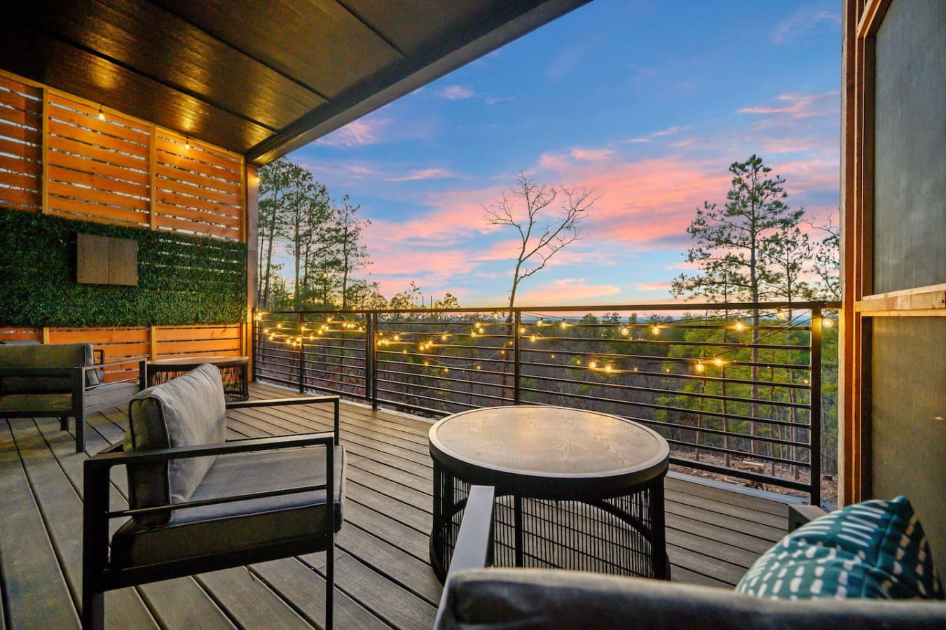 Watching the sunset paint the sky in pink and gold while soaking in the hot tub with twinkling lights strung overhead and endless forest views is basically the definition of a perfect evening.