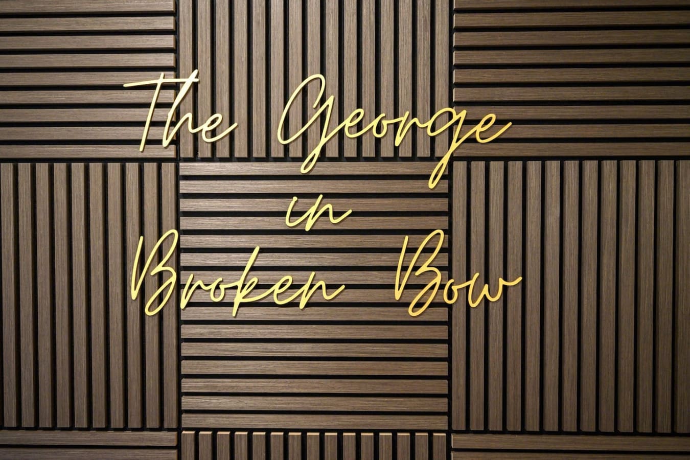 This golden neon sign glowing against the warm wood slats basically captures the whole vibe of this place—a little bit quirky, a whole lot inviting, and definitely the kind of detail that makes you feel like you've stepped into somewhere special.