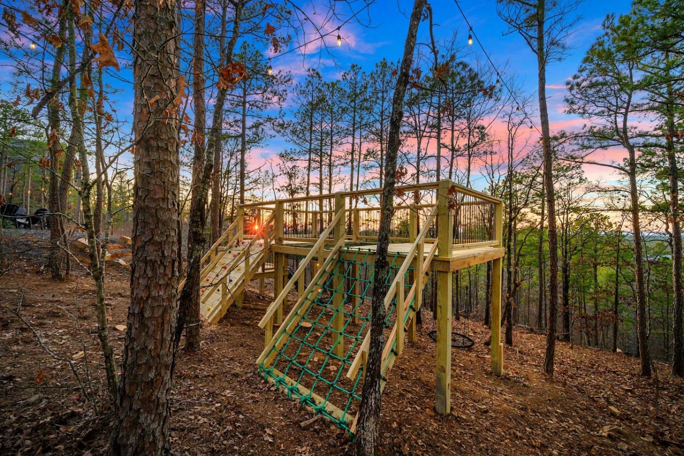 This elevated boardwalk winding through the pine forest basically gives you that perfect sunset-watching perch where you can feel like you're floating above the treetops as the sky turns into pure magic.