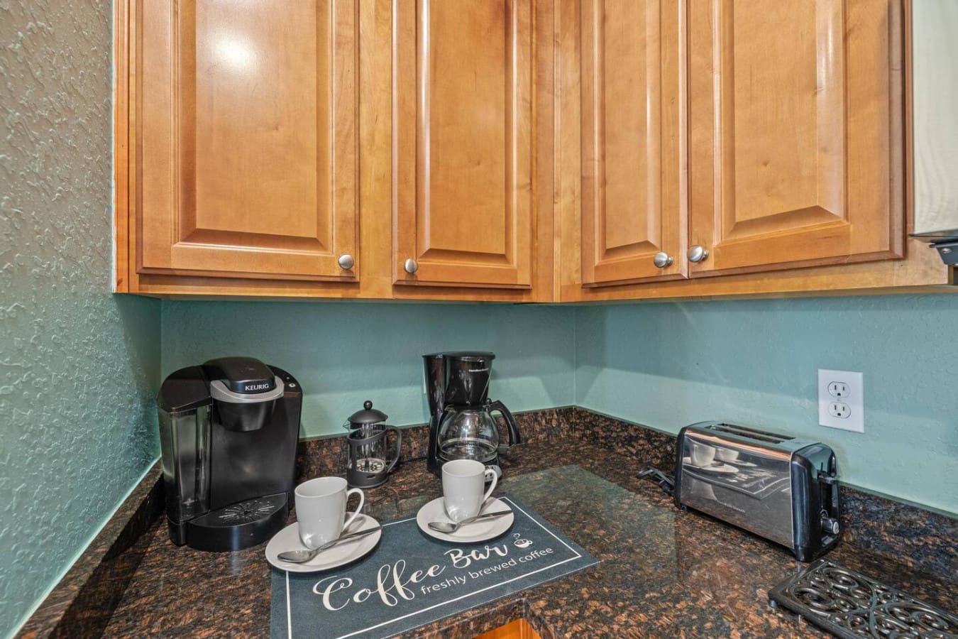 The coffee bar tucked into this kitchen corner is basically the unsung hero of every morning—everything you need to fuel up before heading out to make the most of your beach day.