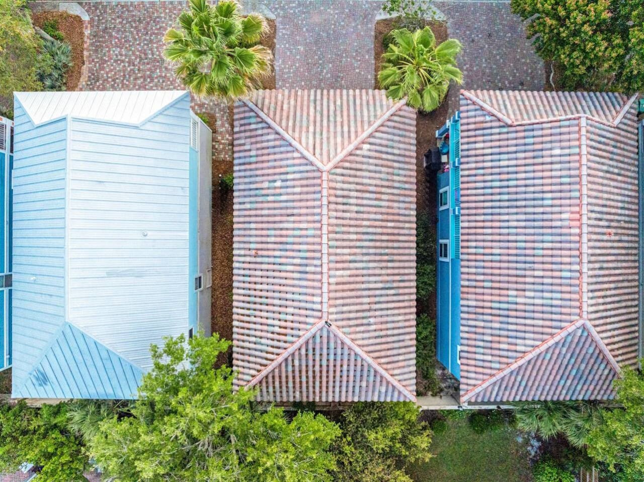 From above, So Stinkin Cute basically looks like the ultimate proof that the best beach vacations are built on charming architecture, lush greenery, and a whole lot of colorful rooflines that make you feel like you've stumbled into the most picturesque co