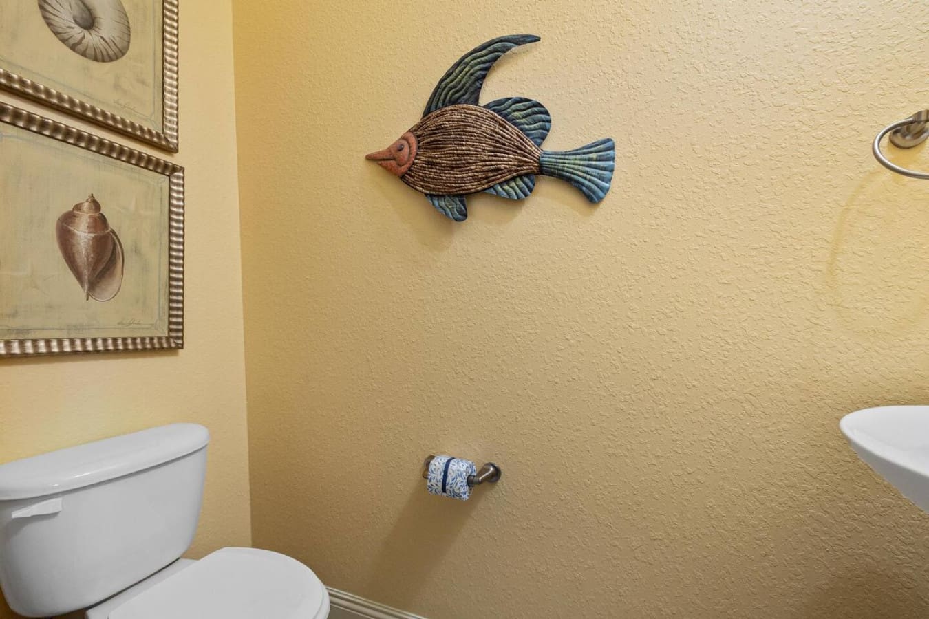 Even the bathroom decor at So Stinkin Cute is totally on-theme—complete with hand-painted fish art that basically confirms you've found your happy place.
