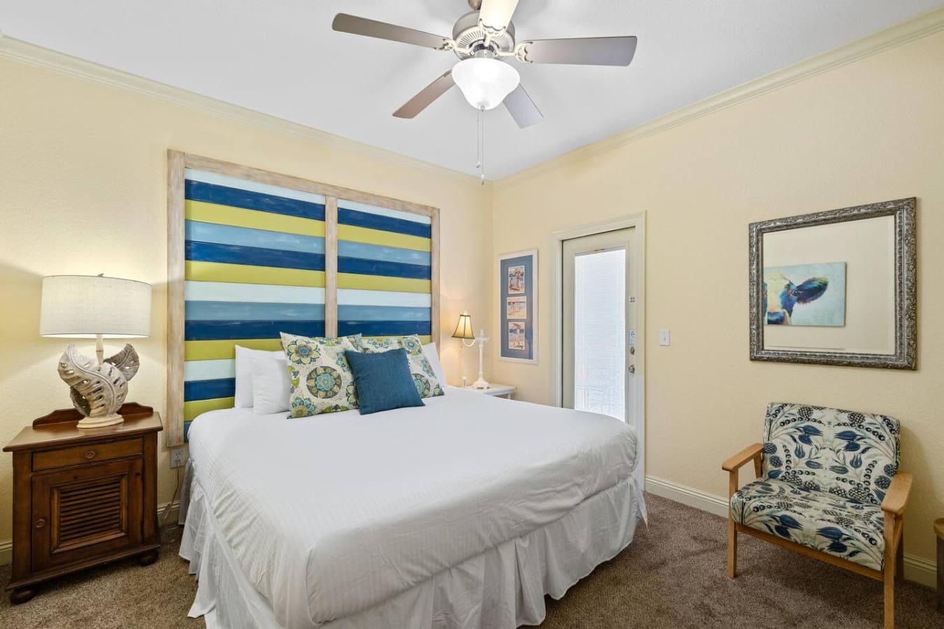 This striped headboard is basically sunshine and ocean waves wrapped up in one cozy spot, complete with those perfectly coordinating pillows that make you want to burrow in and never leave.
