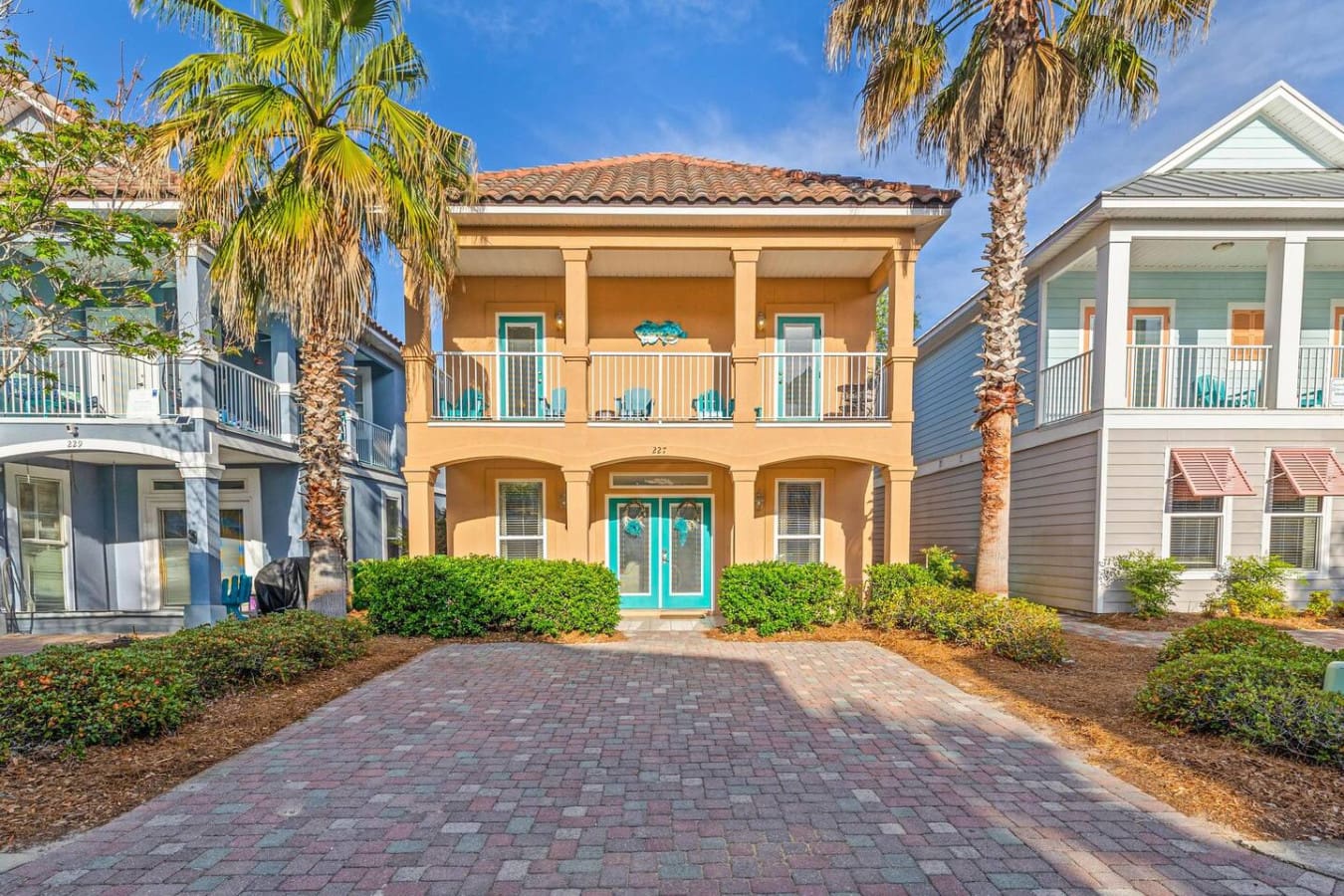This golden beauty with its turquoise doors and palm-lined driveway is the kind of place that makes you wonder why you didn't book it sooner the moment you roll up.