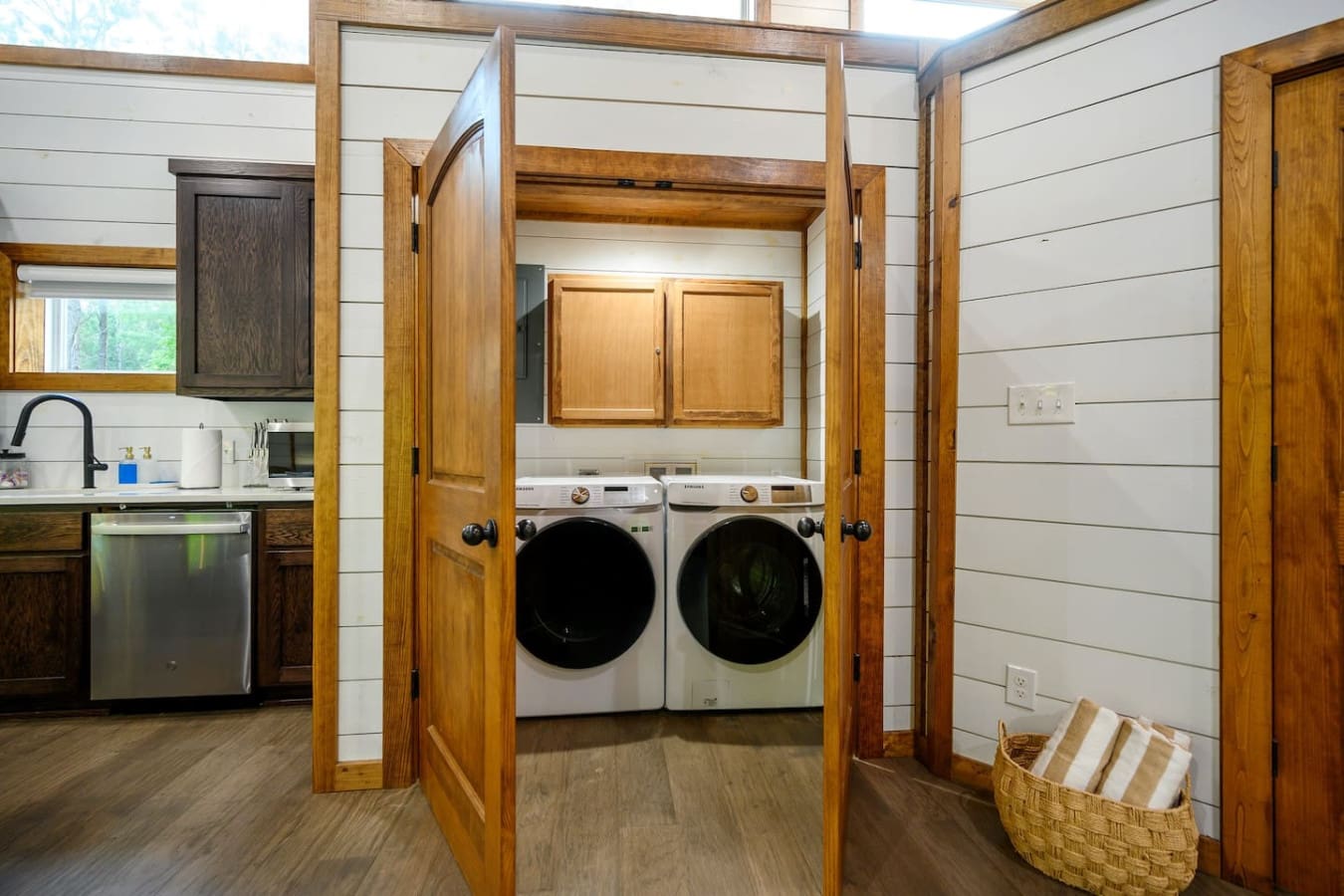 The laundry alcove's got you covered with those modern front-loaders hidden behind beautiful wooden doors, so you can knock out a load or two without it eating up your vacation time.