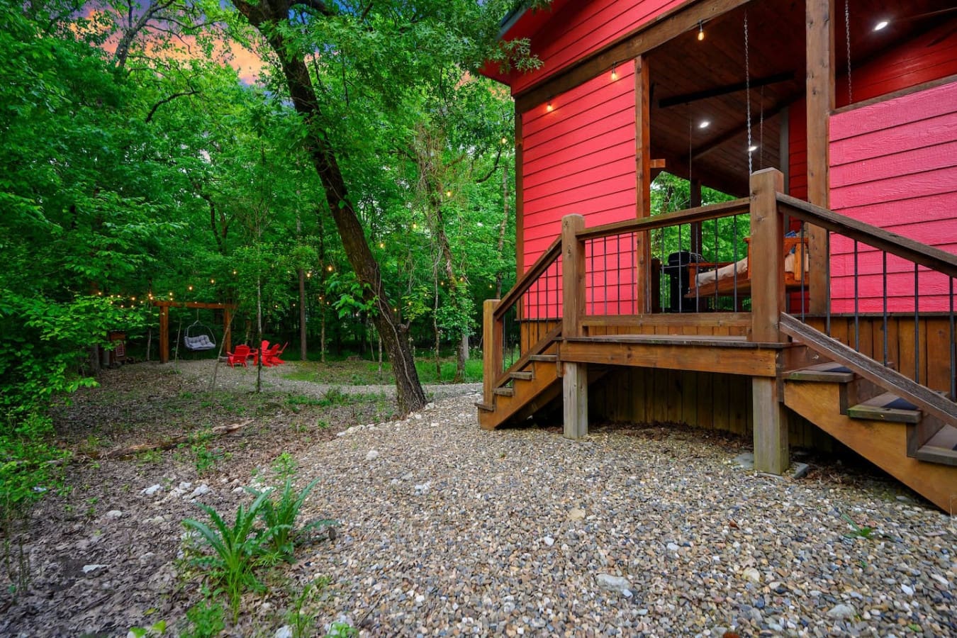 The gravel yard spreading out from your deck is basically the perfect blank canvas—whether you're setting up lawn games, building a bonfire, or just letting the kids run wild while you keep an eye on them from the porch.