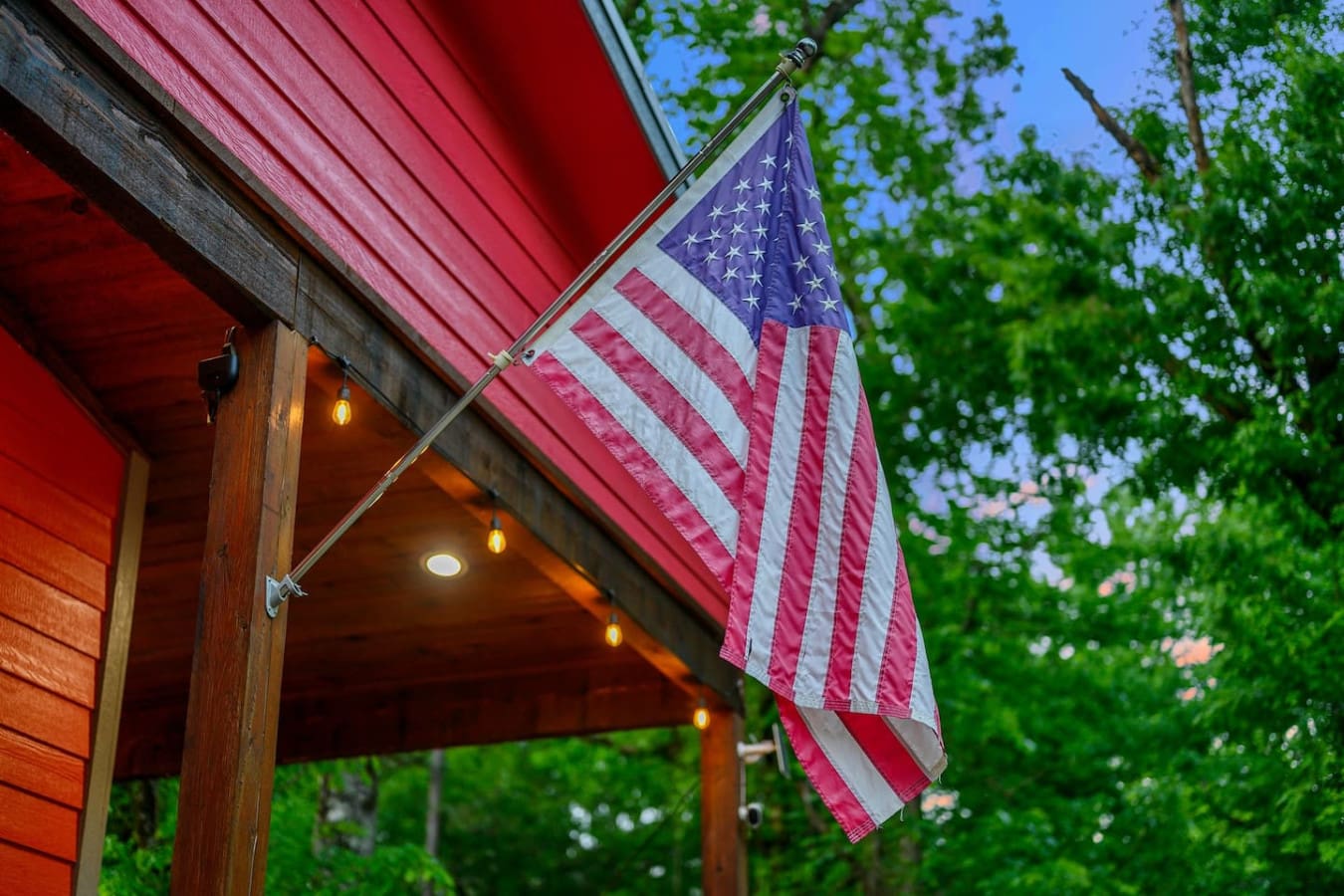 Nothing says "we're really here to relax" quite like an American flag flying proud from your own private forest retreat.