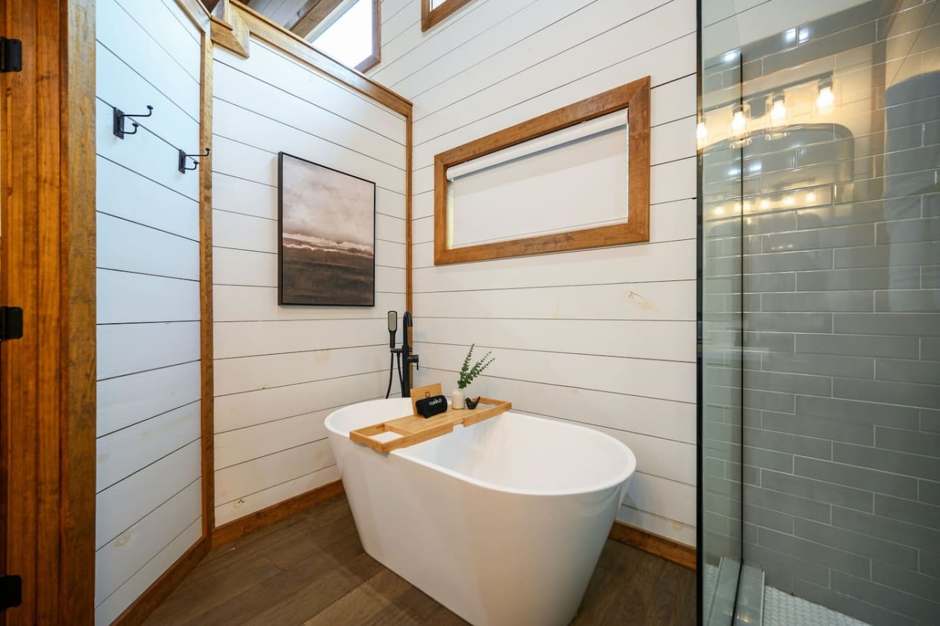 Slide into this soaking tub surrounded by shiplap and skylights, and you'll understand why this bathroom feels less like a practical necessity and more like your own personal retreat.