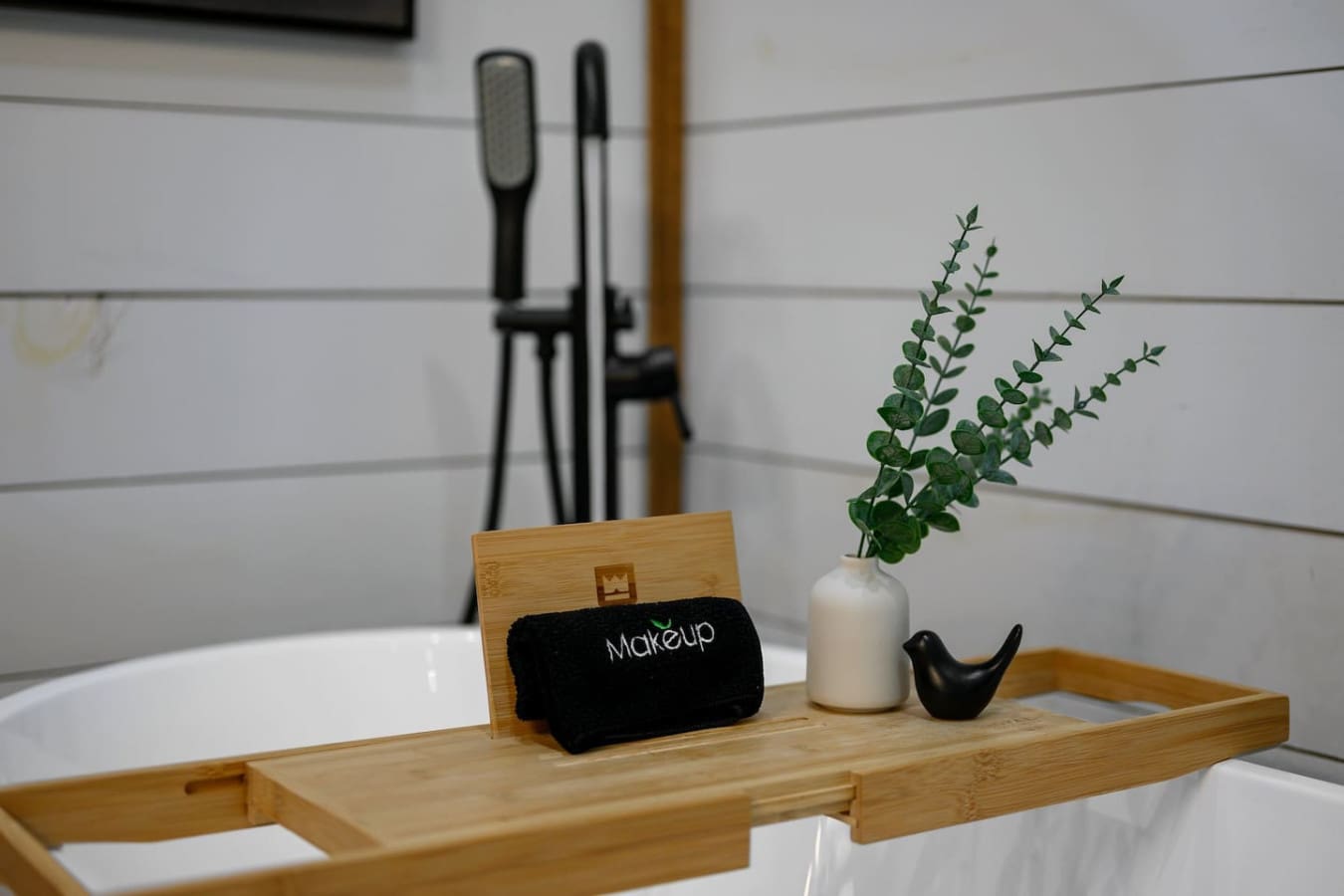 This little bathroom shelf setup—complete with fresh eucalyptus, a ceramic bird, and a makeup towel—is basically proof that even the smallest spaces can feel intentional and put-together.