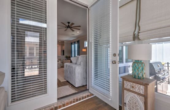 These sliding glass doors with those practical built-in blinds give you the perfect way to control the light and privacy while still keeping that seamless connection between your bedroom and the rest of the space.