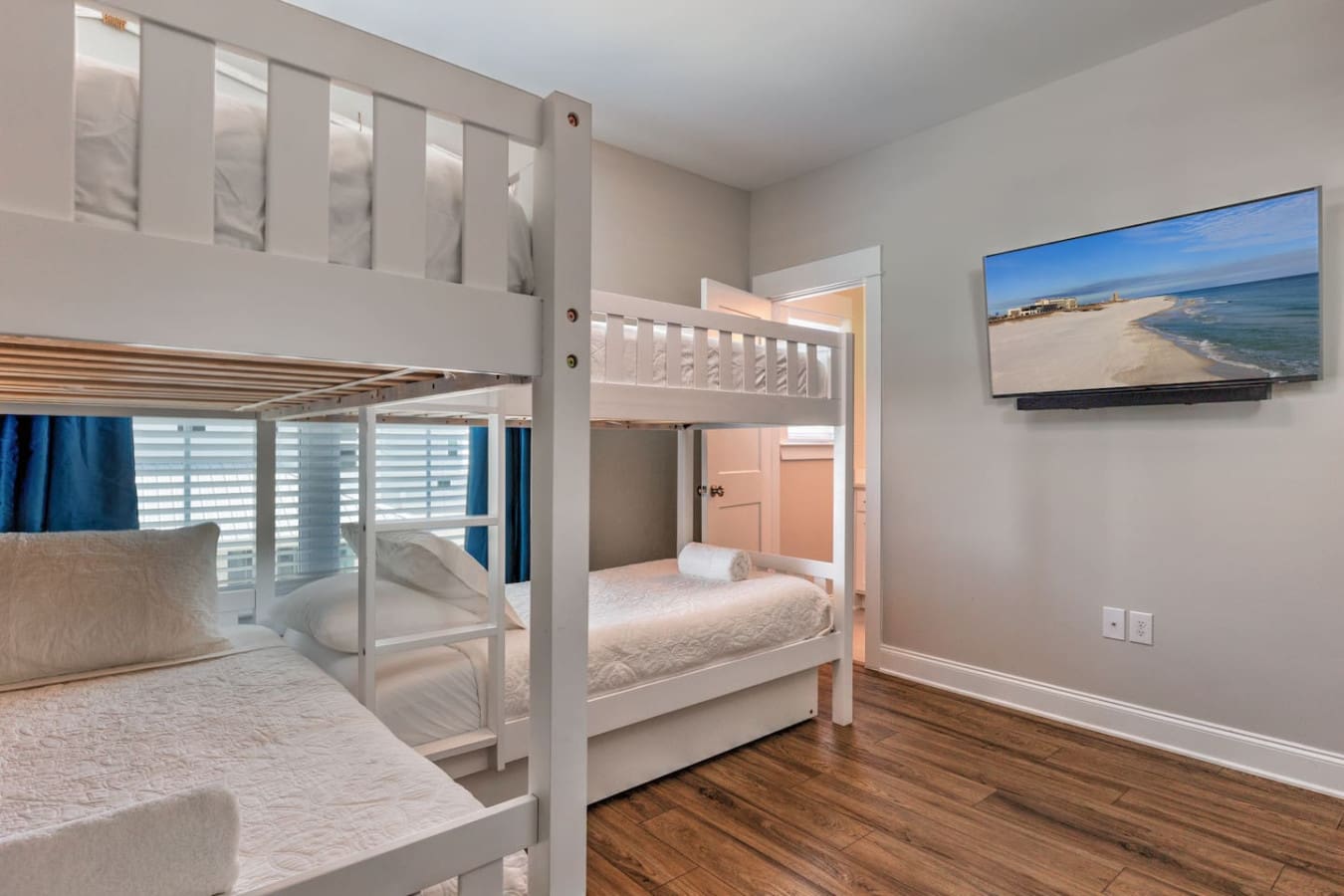 This bunk room is perfect for the kids to have their own little sleep sanctuary while you catch those beach views on the TV and actually get some peace and quiet.