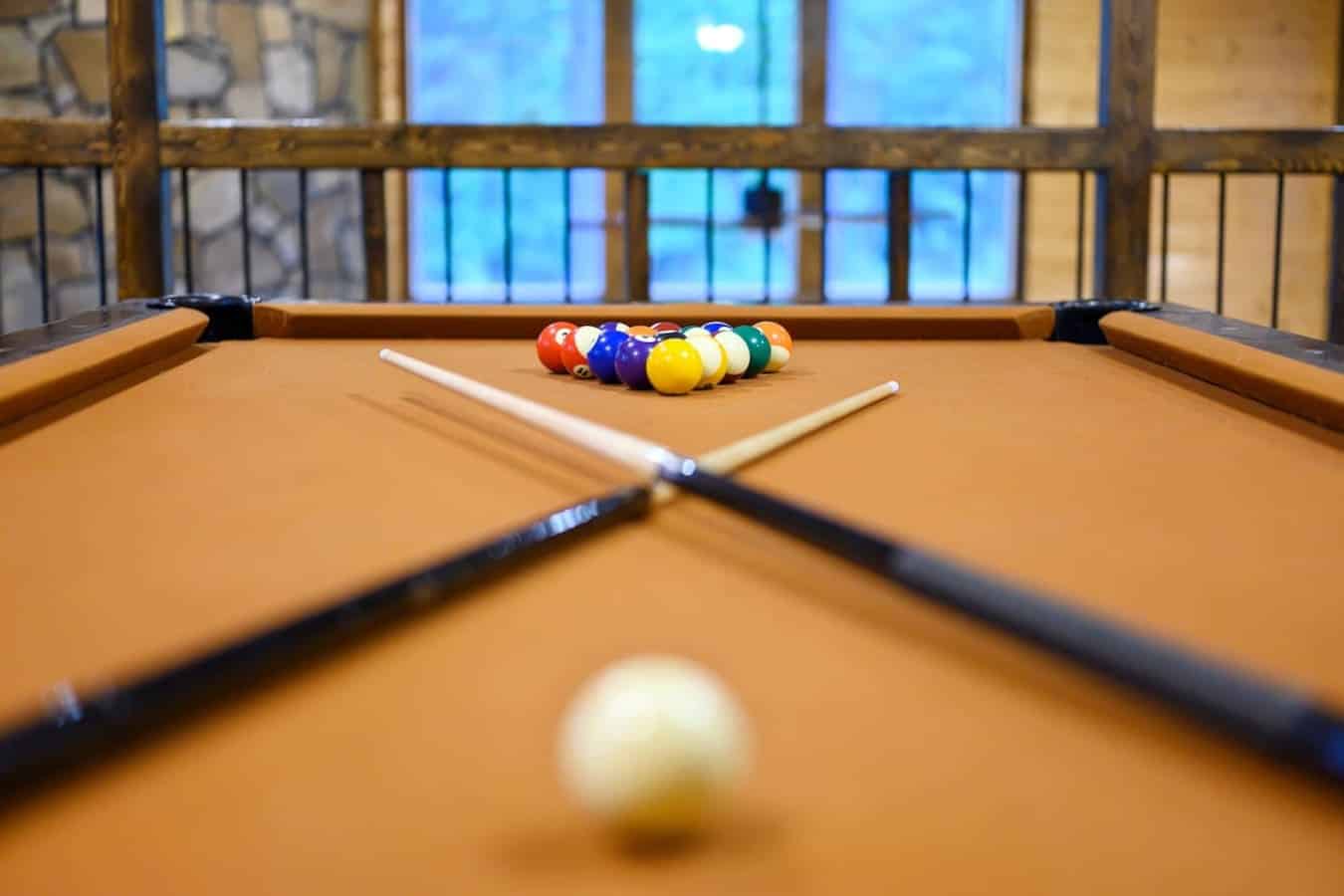 Yeah, this pool table's seen some action—grab a cue and get ready to settle some friendly disputes with a view.