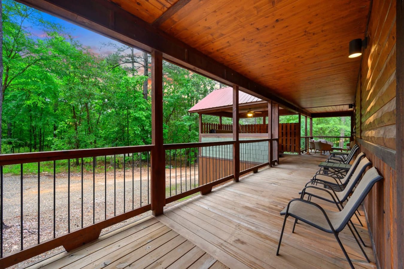 The covered porch wraps around the whole place with enough lounge chairs that everyone gets their own spot to just sit and zone out into the woods.
