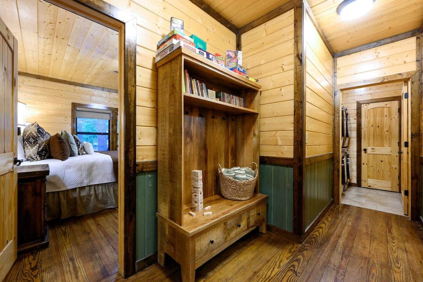 This mudroom's basically your command center for the week—hooks for everything, shelves for your stuff, and that bench situation so you can actually sit down and get your boots on without blocking the hallway.