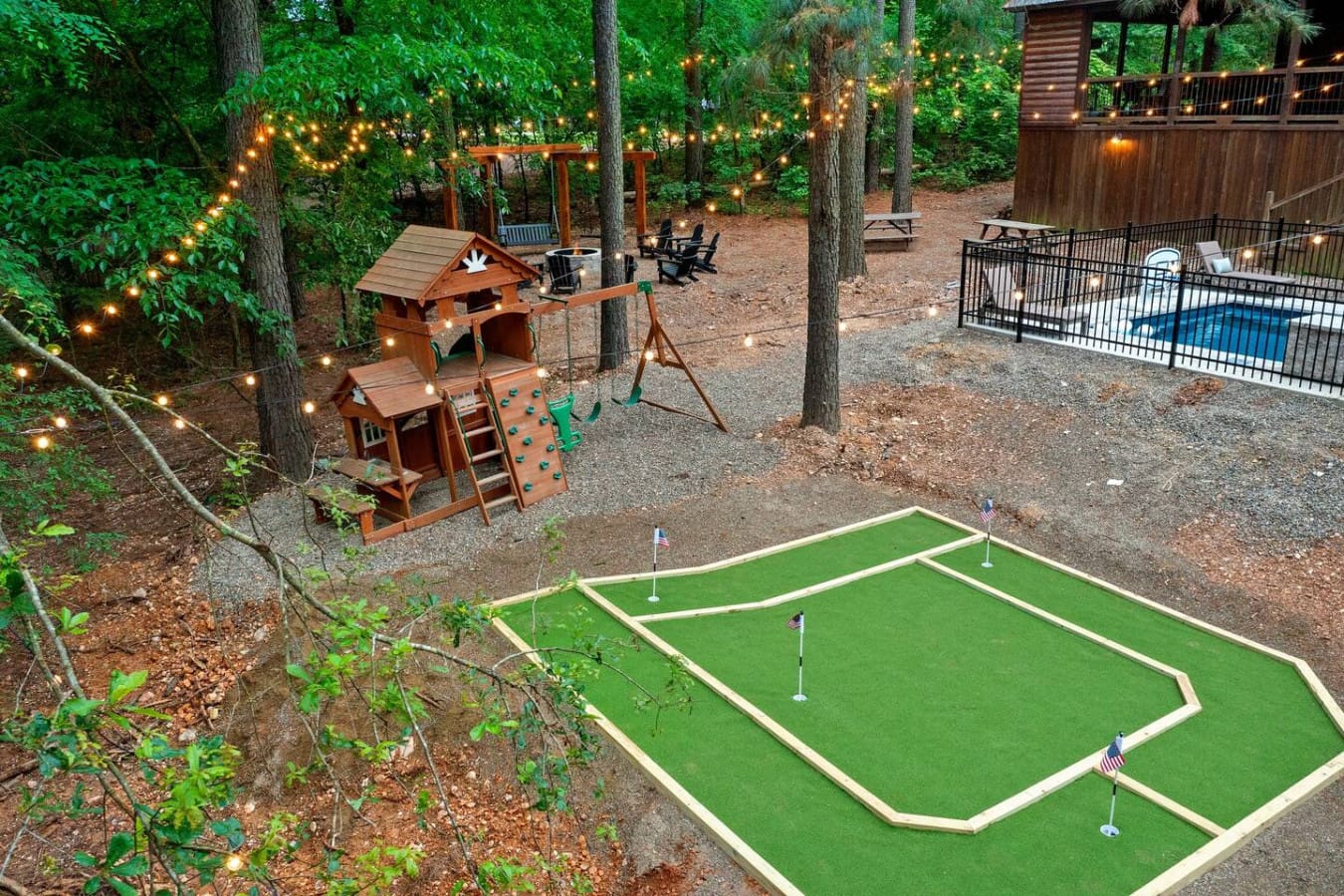 Throw your competitive side around on this mini golf course tucked into the trees, then wander back to the playground and string lights whenever you need to switch things up.