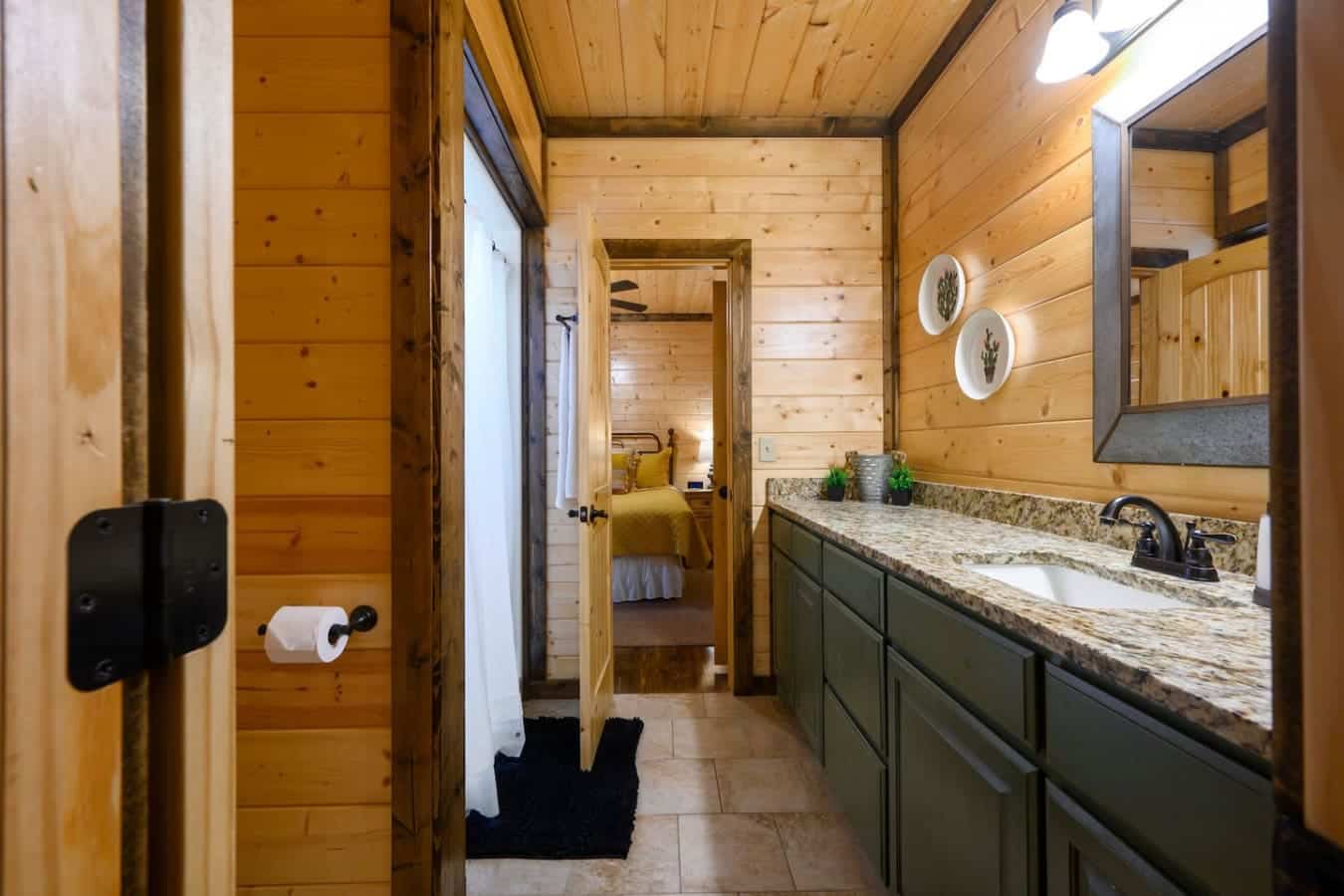 This bathroom's basically your spa day sorted—double vanity with plenty of counter space, that granite top that doesn't show every water spot, and a mirror that actually lets you see what you're doing without squinting.