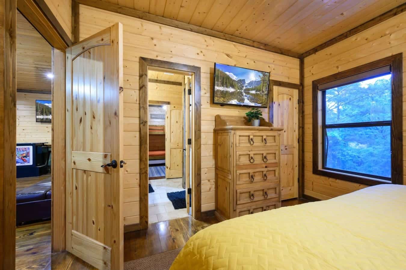 This master suite is basically your own little retreat—a huge bed, your own bathroom attached, big windows looking out at the views, and enough space that you're not tripping over your travel buddies every time you turn around.