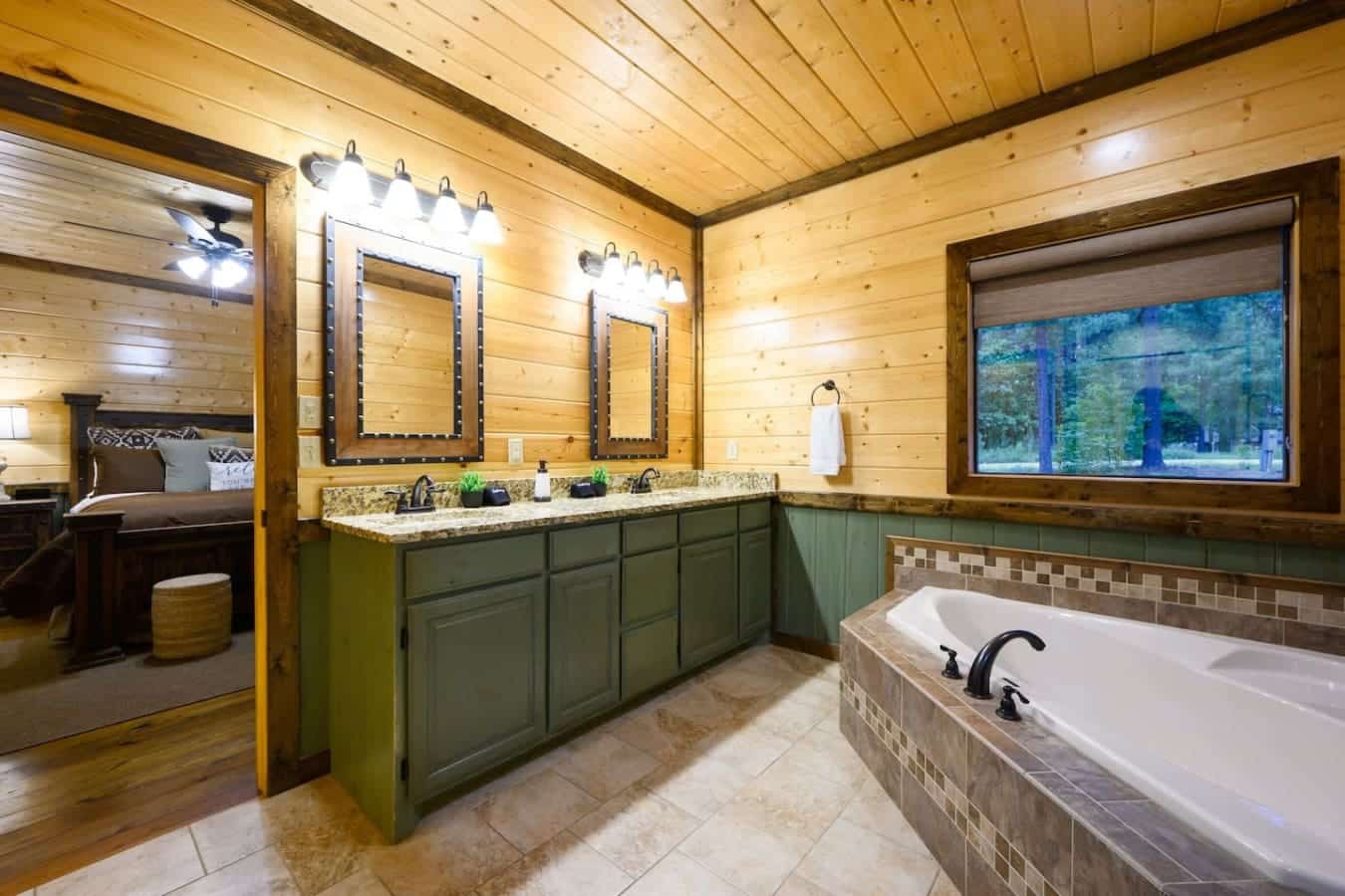 This master bath is basically a two-for-one situation where you can soak in that tub while staring out at the trees, then hop into the walk-in shower when you actually need to get clean.