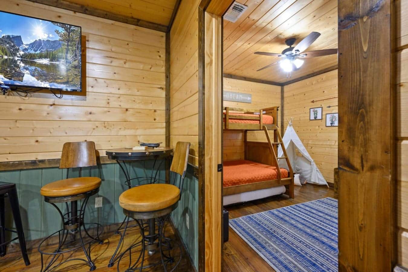 This bedroom's basically your own little hideaway with those bunk beds, a teepee fort situation, and enough going on that the kids will actually want to hang out here instead of bugging you all week.