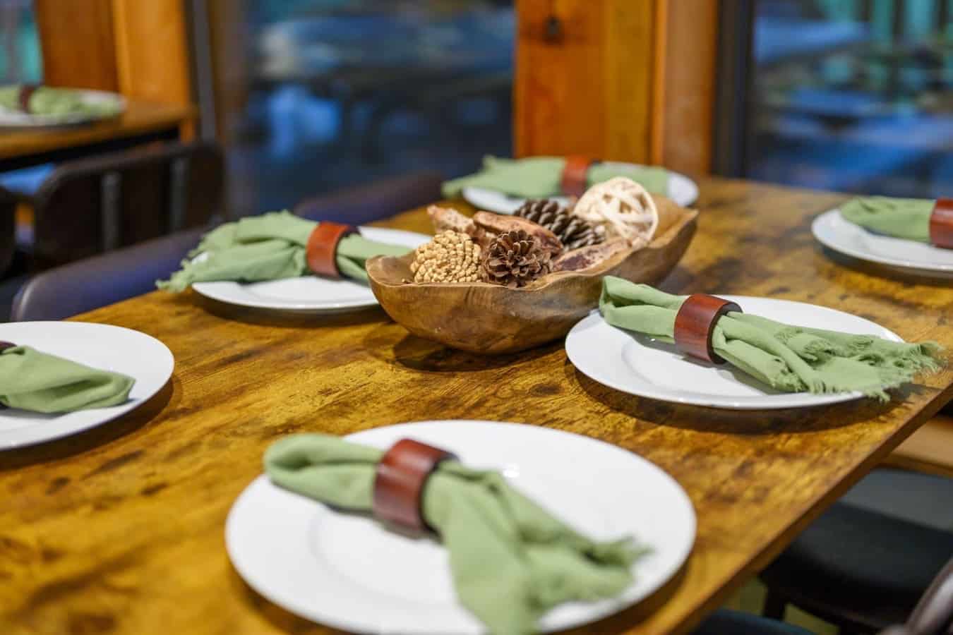 The dining table's got enough space to gather everyone around, and someone clearly put thought into making the table setting actually look nice.