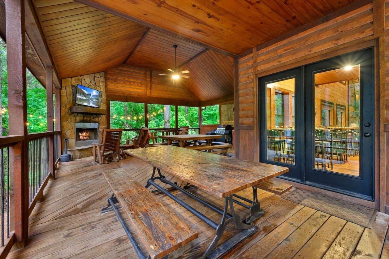 This screened porch basically has everything—fireplace, picnic tables, a view that goes on forever, and enough space that you could honestly just live out here for the whole trip.