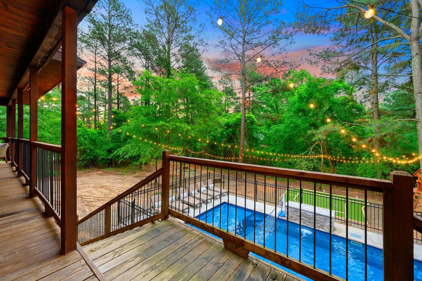 Wake up to a view of the pool framed by a forest of towering pines, fairy lights strung through the trees, and the kind of quiet that makes you actually want to unplug for a few days.