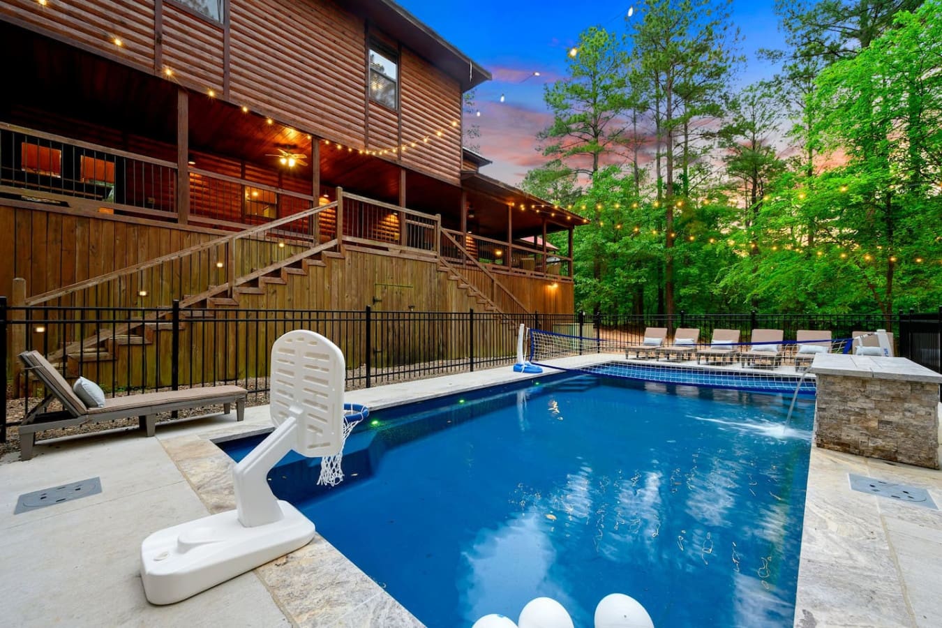 Grab a floatie, sink into one of those loungers, and spend your days doing laps or just floating around while the forest watches over everything.