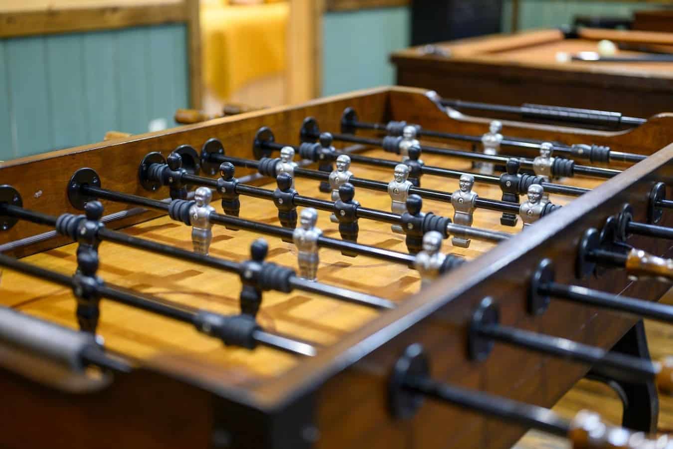 This foosball table's been through enough tournaments that you know it's actually playable, not just some dusty decoration sitting in the corner.