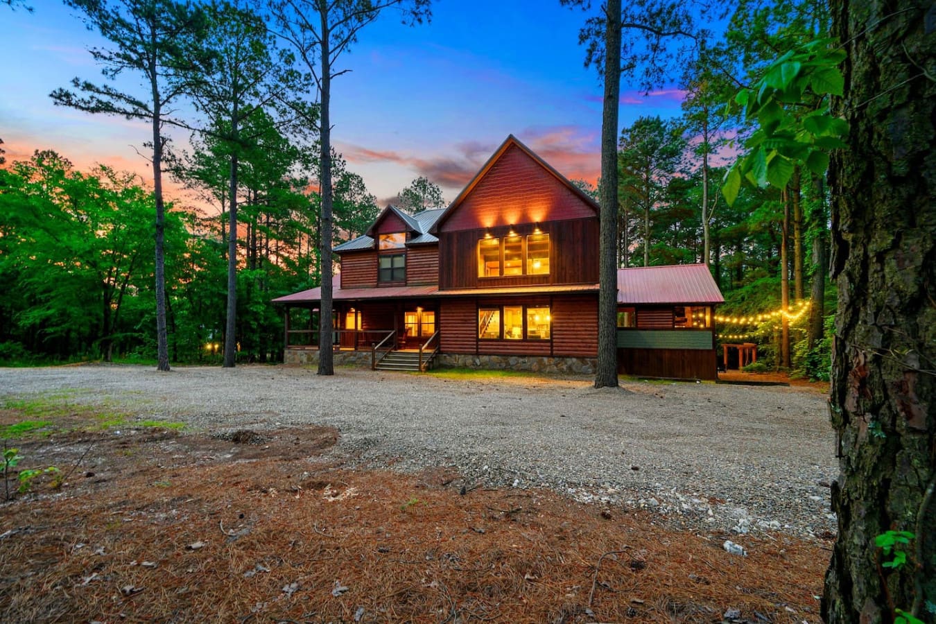 This wood cabin tucked into the pines lights up like a warm beacon at dusk, and honestly, it's the kind of place that makes you want to just stay put for days.