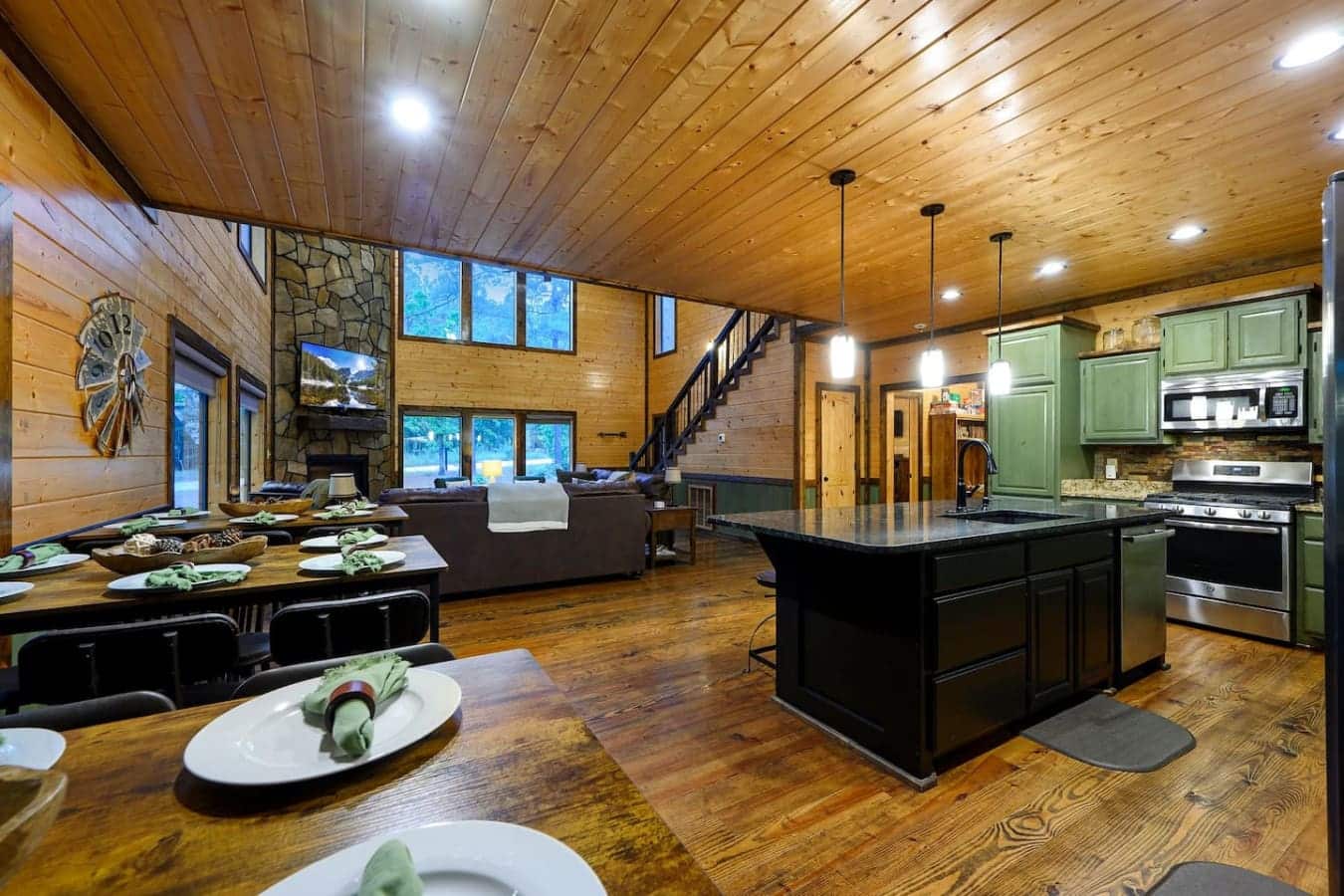 This whole open floor plan is basically one big room where the kitchen, dining, and living areas all flow together so you're never actually cooking alone or eating separated from the action.