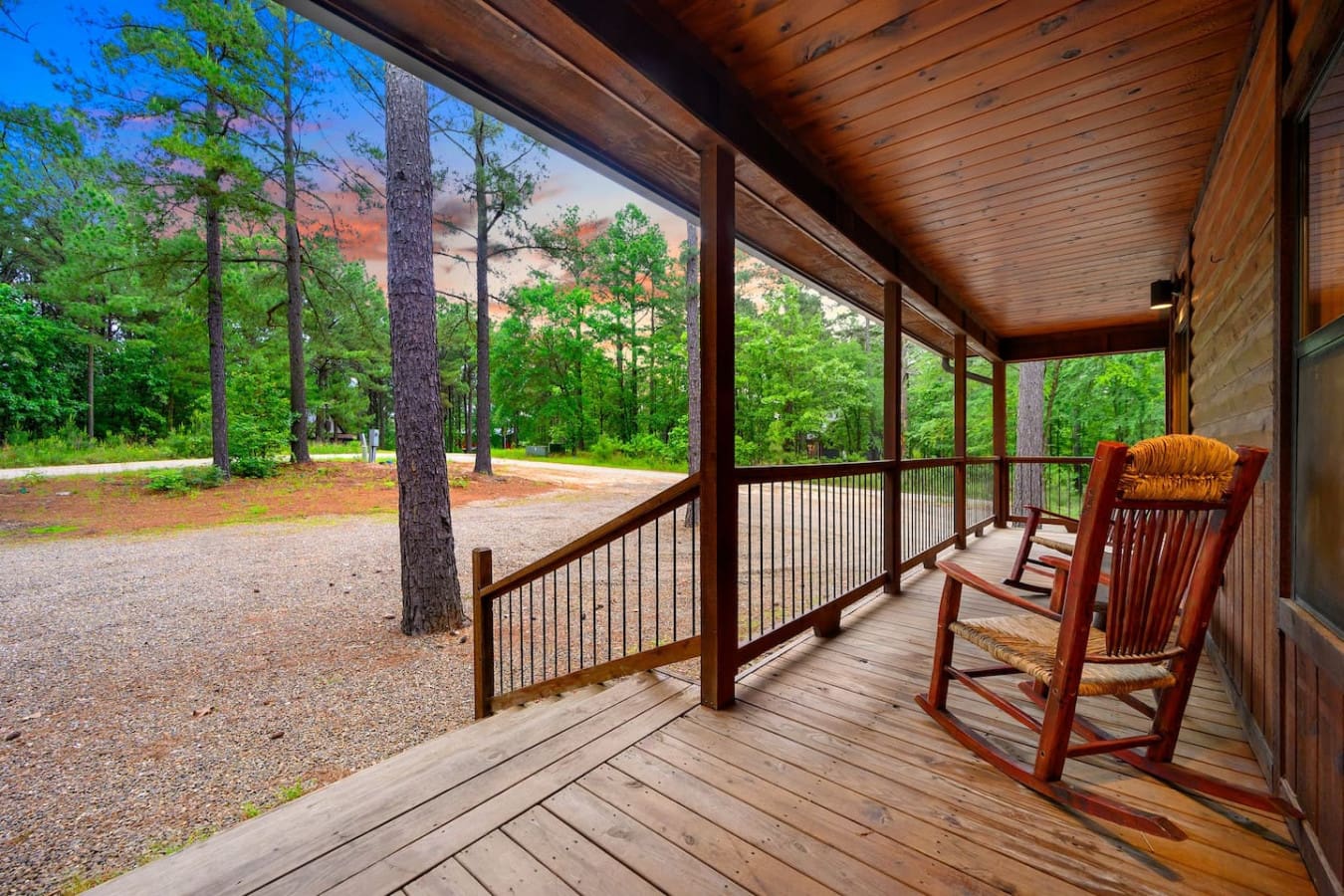Grab a rocking chair and zone out on this porch—you've got the whole forest as your view and absolutely nothing else to do.